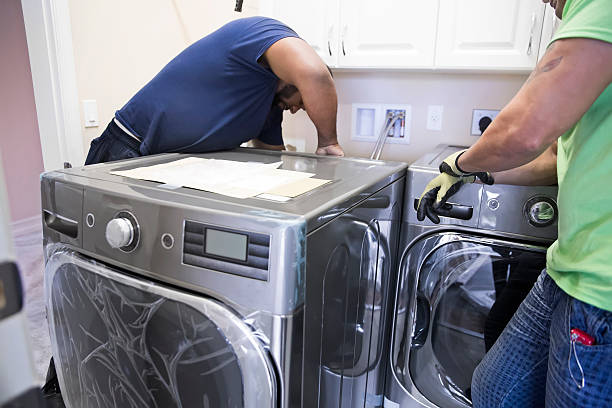 Electrician installing washer and dryer